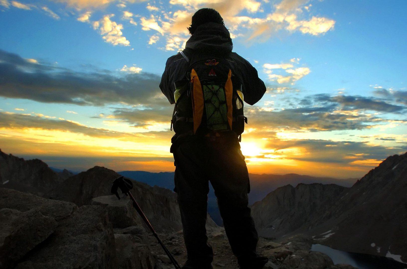 Timothy Sanchez soaks up a sunrise at 12,000 feet from the east face of Mount Whitney. Sanchezs group began its ascent of the 14,496-foot summit at midnight. (Carl Costas/Sacramento Bee/TNS)