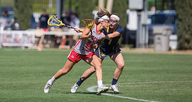 Fresno State freshman midfielder Abigail Bergevin (44) battles Cal’s Meredith Haggerty (7) during the Bulldogs’ 11-10 Senior Day win over the Golden Bears Sunday afternoon.
