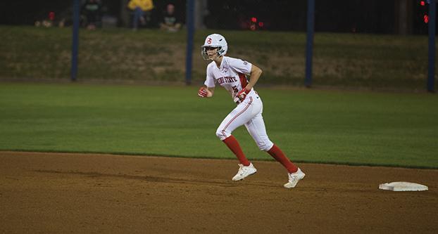 Photo+caption%3A+Fresno+State+senior+outfielder+Brenna+Moss+aims+to+run+from+second+to+third+base+during+the+%E2%80%98Dogs%E2%80%99+Feb.+13+game+against+UC+Riverside.+%28Darlene+Wendels%2FThe+Collegian%29