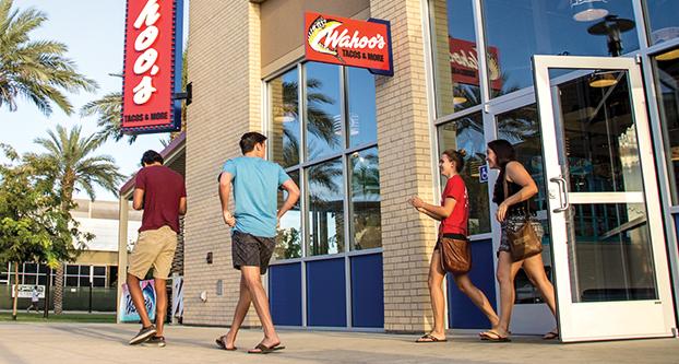 Customers walking out of Wahoo’s, on Tuesday, Aug. 25, 2015. Wahoo’s is one of the new restaurants that opened up in Campus Pointe.  