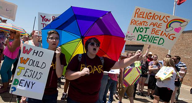 Defenders of same-sex marriage gather at the courthouse in Granbury, Texas, on Thursday, July 2, 2015, amid dueling same-sex marriage rallies. (Joyce Marshall/Fort Worth Star-Telegram/TNS)