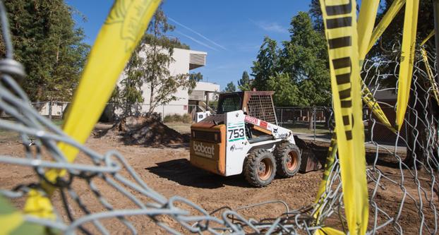 A Bobcat skid-steer loader sits in a construction site outside of McLane Hall at Fresno State, Thursday, Aug. 27, 2015. (Darlene Wendels, The Collegian)