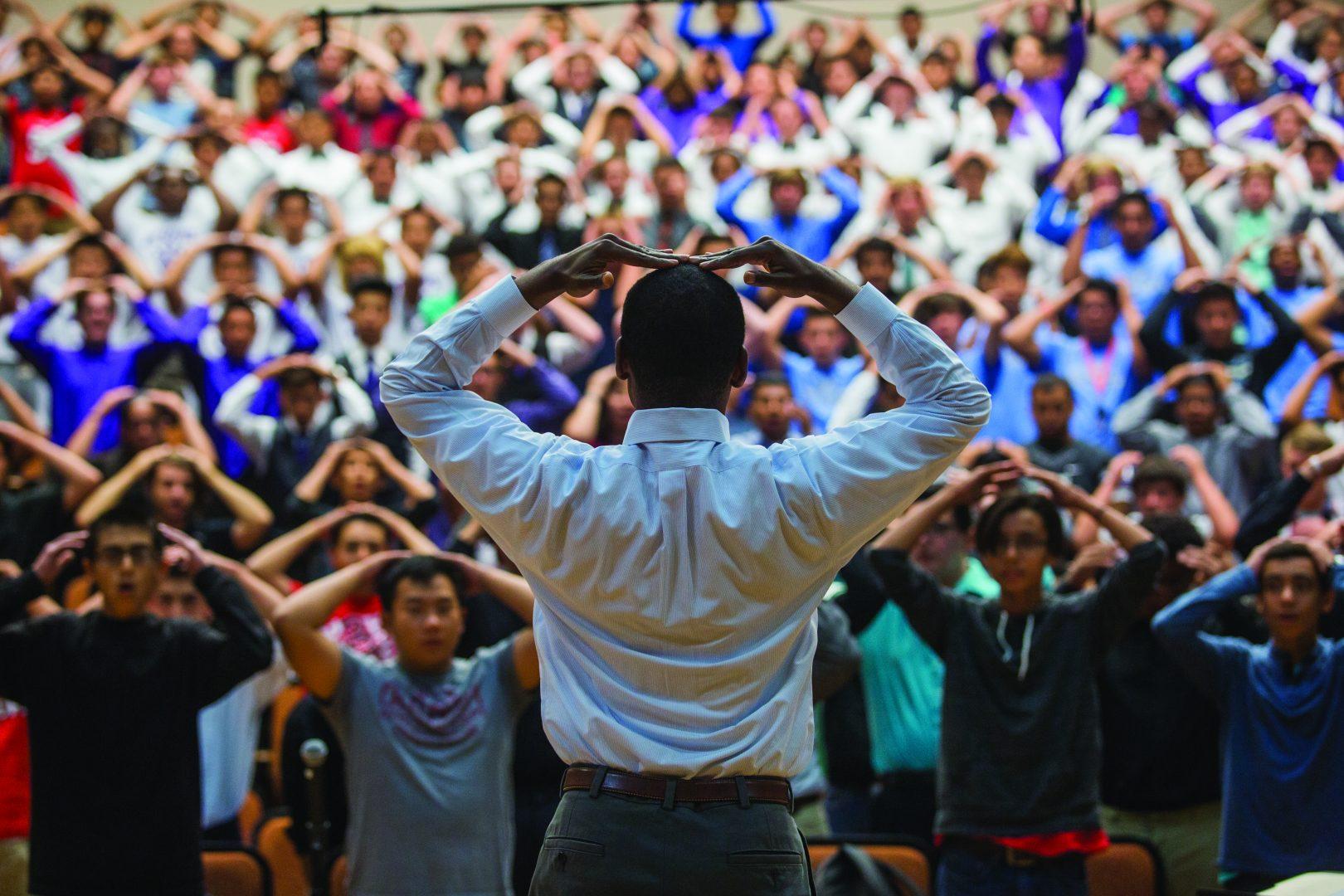 Guest clinician Dr. Rollo Dillworth of Temple University, leads high school choral students in a singing exercise in the Concert Hall at Fresno State for the 14th annual Real Men Sing, Friday, Sept. 18, 2015. The men’s choir festival drew over 700 Central Valley students to campus for the two-day event.  (Darlene Wendels, The Collegian
