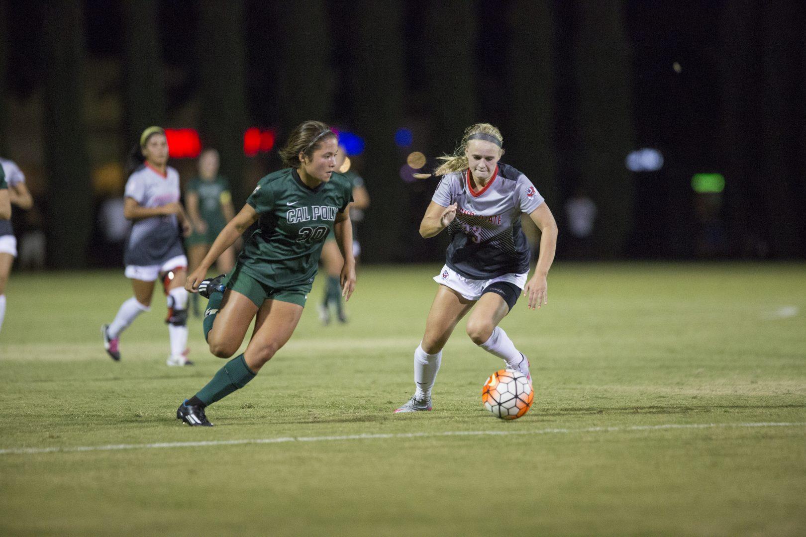 Fresno State sophomore Sara Jo Ciapponi engages with Cal Poly freshman forward Caitlyn Kreutz during Sunday’s nonconference match at the Soccer and Lacrosse Field. (Khone Saysamongdy/The Collegian)