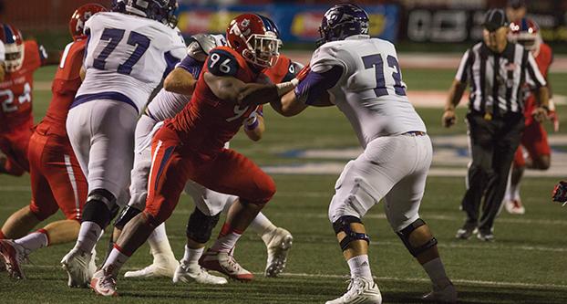Fresno State defensive end Todd Hunt (96) engages with an Abilene Christian offensive lineman during the Sept. 3 season opener at Bulldog Stadium. (Darlene Wendels/The Collegian)