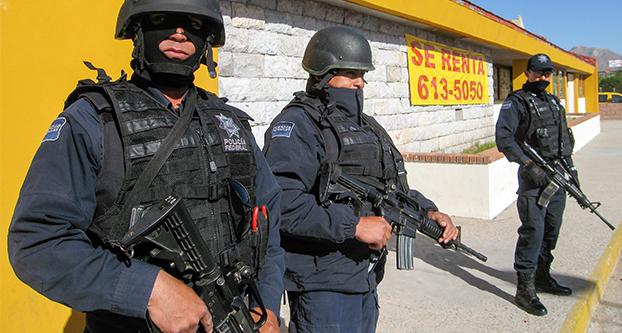 Thousands of heavily armed federal police patrol Ciudad Juarez, Mexico, to keep narcotics cartels at bay, April 8, 2010. (Tim Johnson/Tribune News Service)