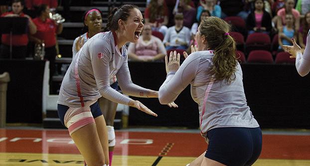 Junior setter Brooke Legaux (left) and sophomore outside hitter Carly Scarbrough (right) celebrate after Fresno State’s 3-0 sweep of Mountain West Conference rival Nevada. (Darlene Wendels/The Collegian)