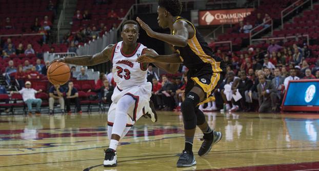Fresno State senior guard Marvelle Harris battles with a defender during the Bulldogs’ exhibition game against Dominican University of California on Friday at Save Mart Center. (Darlene Wendels/The Collegian)