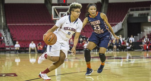 Fresno State senior guard Brittany Aikens drives to the basket during Tuesday’s blowout win over Fresno Pacific. (Khone Saysamongdy/The Collegian)