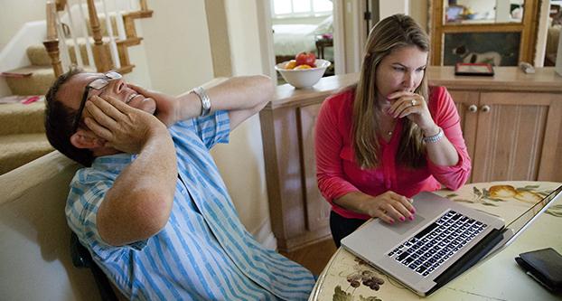 Will, left, and Lia MacDonald search for the revealing Facebook messages that Will received from someone claiming to be Lias friend Jenna, at their home in Los Gatos, Calif., Aug. 24, 2013. (LiPo Ching/Bay Area News Group/TNS)
