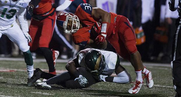 Fresno State senior running back Marteze Waller gets tackled by Colorado State defender during Saturday night’s season finale against the Rams at Bulldog Stadium. (Darlene Wendels/The Collegian)