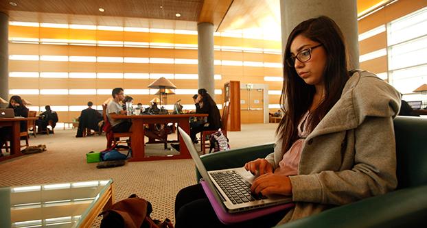Sophomore Aimme Ruiz works on an essay for her Psychology 15 class in the Kolligian Library on the UC Merced campus on Dec. 10, 2014 in Merced, Calif. Ruiz, who is studying psychology at the university, is one of the beneficiaries of the UC Referral Guarantee, a second chance program for applicants who were rejected at other universities in the UC system. Genaro Molina/Los Angeles Times/TNS
