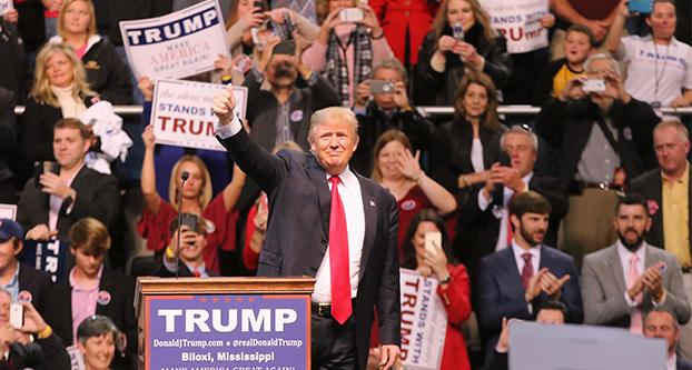 Republican presidential candidate Donald Trump greets the crowd during a rally at the Mississippi Coast Coliseum in Biloxi, Miss., on Saturday, Jan. 2, 2016. (John Fitzhugh/Biloxi Sun Herald/TNS)
