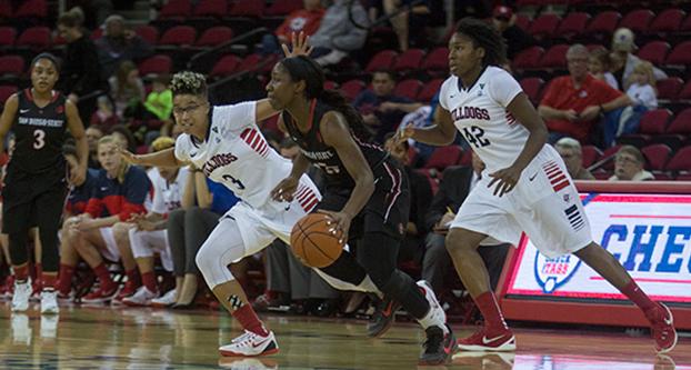 Fresno State’s Brittany Aikens (3) and Toni Smith (42) defend a San Diego State’s Mckynzie Fort during Wednesday’s 54-49 conference win over the Aztecs at Save Mart Center. (Darlene Wendels/The Collegian)