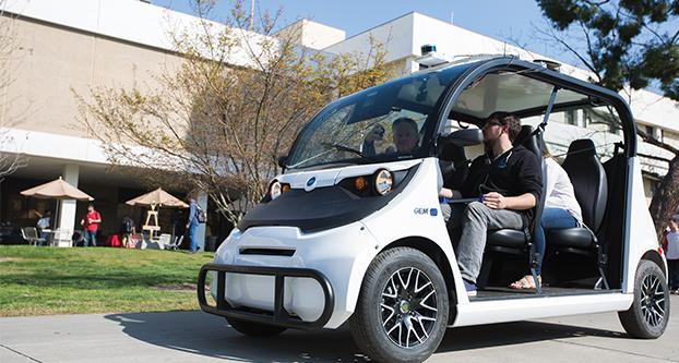 Officials of Varden Labs, a student run company, demonstrates their electric, autonomous shuttle in front of the Lyles College of Engineering for National Engineers Week, Tuesday, Feb. 23, 2016. (Darlene Wendels/The Collegian)
