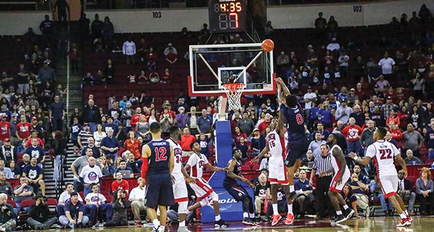 Fresno State senior guard Julien Lewis (0) attempts a jump shot during the Bulldogs’ 111-104 double-overtime victory over the UNLV Rebels on Saturday, Feb. 6, 2016 at the Save Mart Center. (Ricky Gutierrez/The Collegian)