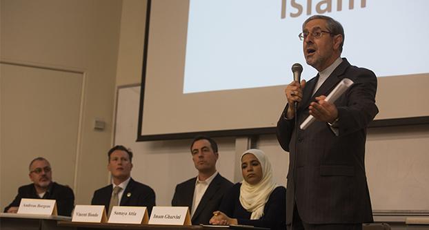 Imam Seyed Ali Ghazvini of the Islamic Cultural Center of Fresno, explains what Islam is to attendees of a panel discussing the Islamic State of Iraq and Syria and Islam in American politics, in McLane Hall, Tuesday, Feb. 2, 2016. The panel also included Fresno State alumnae and online journalist Sumaya Attia, professor of Religious Studies Vincent Biondo, member of the Fresno County Board of Supervisors, Andreas Borgeas and Rabbi Rick Winer of Temple Beth Israel in Fresno. (Darlene Wendels / The Collegian)