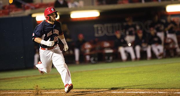 Fresno State junior outfielder Austin Guibor runs toward first base during Tuesday’s 11-10 nonconference win over Oakland University. (Ricky Gutierrez/The Collegian)