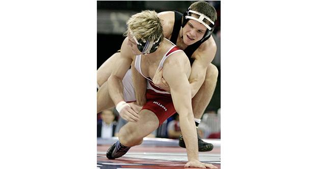 Former+Fresno+State+wrestler+Shane+Seibert+%28above+left%29+during+his+165-pound+match+in+2005+at+the+Save+Mart+Center+against+the+University+of+Iowa.+Seibert+transferred+to+the+University+of+Oklahoma+after+the+program+folded.+%28Collegian+file+photo%29