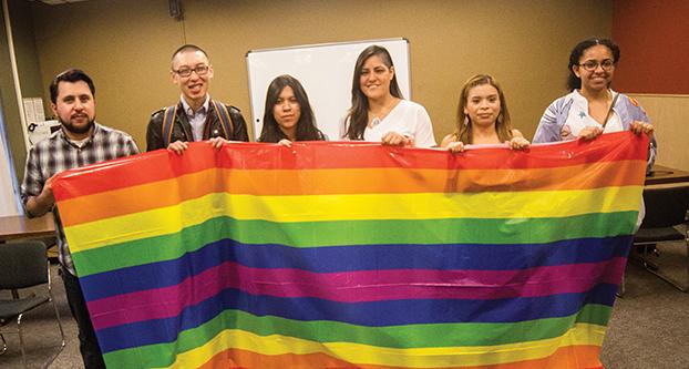 Students at the Queer People of Color panel discussion hosted by the Cross Cultural and Gender Center on campus. (Ricky Gutierrez/The Collegian)