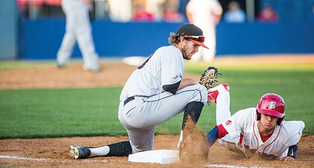 Fresno State junior infielder Ryan Dobson (right) dives and retreats back toward first base during Tuesday’s 7-3 loss to Pacific at Pete Beiden Field. (Khone Saysamongdy/The Collegian)