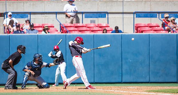 Fresno State junior outfielder Jake Stone records a hit during Sunday’s conference matchup between the ‘Dogs and Wolf Pack. (Khone Saysamongdy/The Collegian)