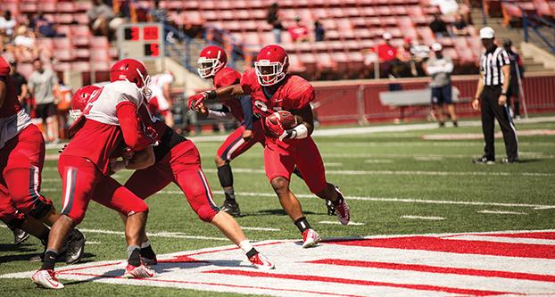 Fresno State running back Dontel James cuts back up the middle during the Bulldogs’ Spring Showcase on Saturday, April 2 at Bulldog Stadium. (Ricky Gutierrez/The Collegian)