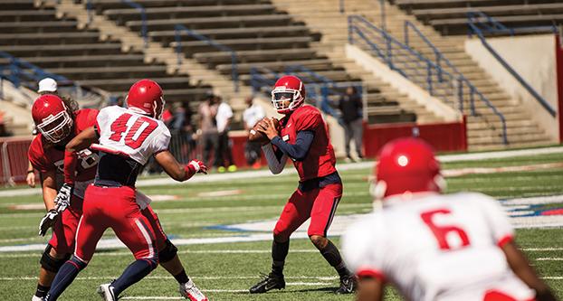 Fresno State redshirt freshman quarterback Chason Virgil drops back for a pass during Saturday’s Spring Showcase. (Ricky Gutierrez/The Collegian)