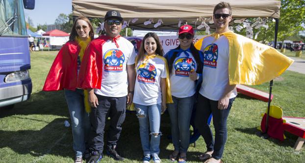Fresno State Public Relations students promote their campaign #ShareAPair at Vintage Days on Friday, April 15, 2016. The #ShareAPair campaign collects socks and undergarments for kids and gives its proceeds to the Marjaree Mason Center and to Catholic Charities.  (Darlene Wendels/The Collegian)