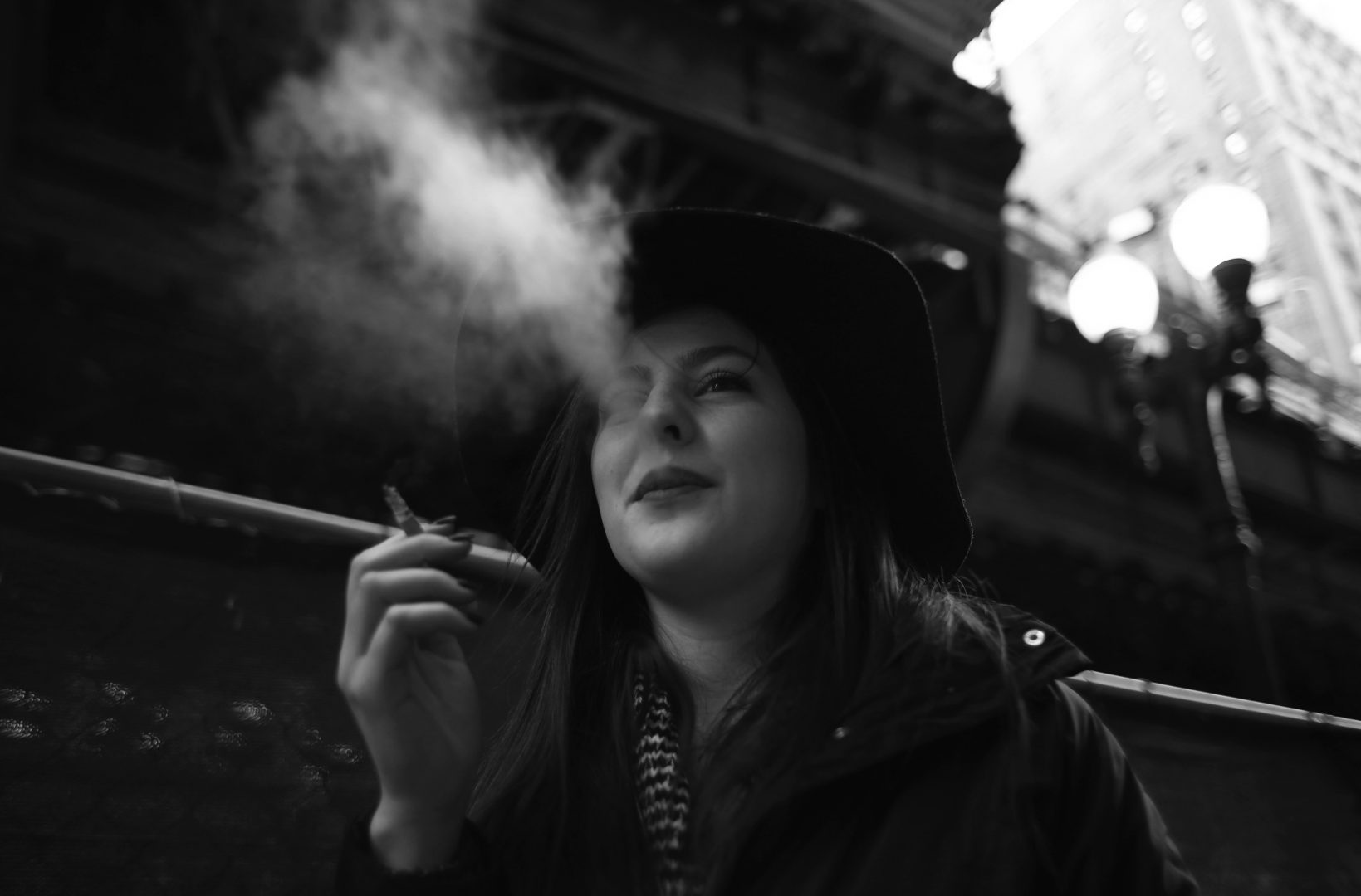 Melanie Walchli, 20, smokes during a downtown Chicago walk on January 14, 2016. She said she supports the idea of raising the minimum age to buy tobacco. Mayor Rahm Emanuel is proposing raising the minimum age to buy tobacco from 18 to 21. (Abel Uribe/Chicago Tribune/TNS)