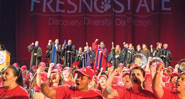 The Fresno State Band and Administration participate in singing the Fresno States Fight Song during the Bulldog Bash held in the Save Mart Center. Aug. 19. 2016. (Christian Ortuno/The Collegian) 