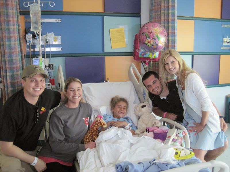 Former Bulldog quarterback Derek Carr and wife Heather spend time with a Valley Children’s patient and her family. (Courtesy of Valley Children’s Hospital)