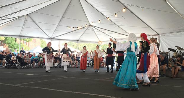 Professional dancers perform traditional Greek dances in effort to share their culture at Greek Fest at Clinton Avenue and First Street on Saturday. (Marina McElwee/The Collegian)