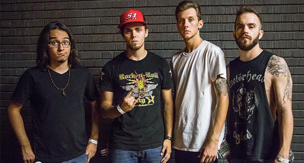The band Days Under Authority poses for the camera after their performance at Fulton 55 in Downtown Fresno Aug. 24, 2016. From left to right: Anthony Yanez (lead guitar), Zach Corsi (main vocals), Brenden Bonsel (drums) and Dom Cassinerio (bass guitar).  (Khonesavanh Saysamongdy/The Collegian) 