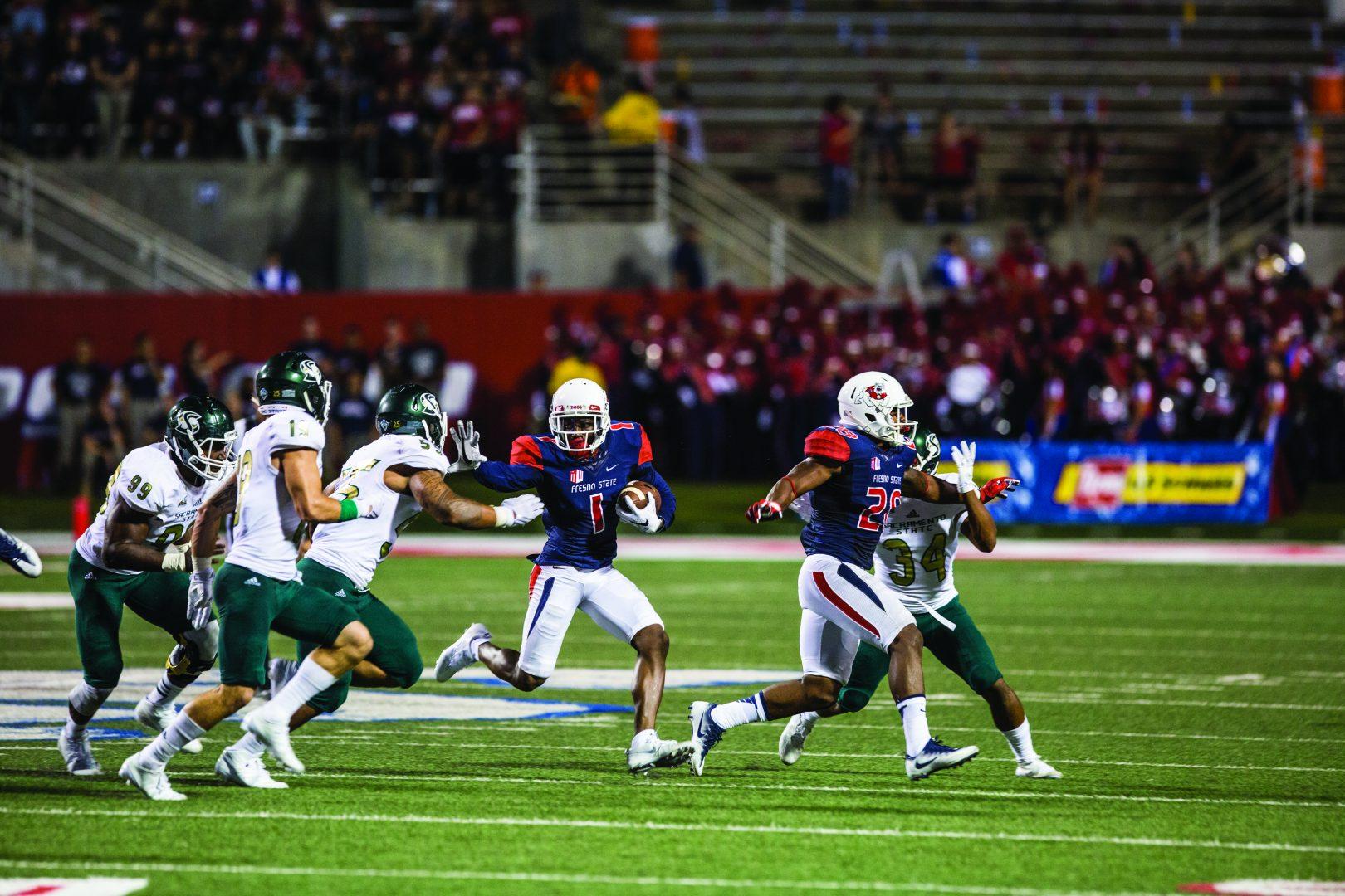 Sophomore wide receiver Jamire Jordan (#1) stiff arms a defender in the football teams home-opener against Sacramento State at Bulldog Stadium. (Khone Saysamongdy/ The Collegian)