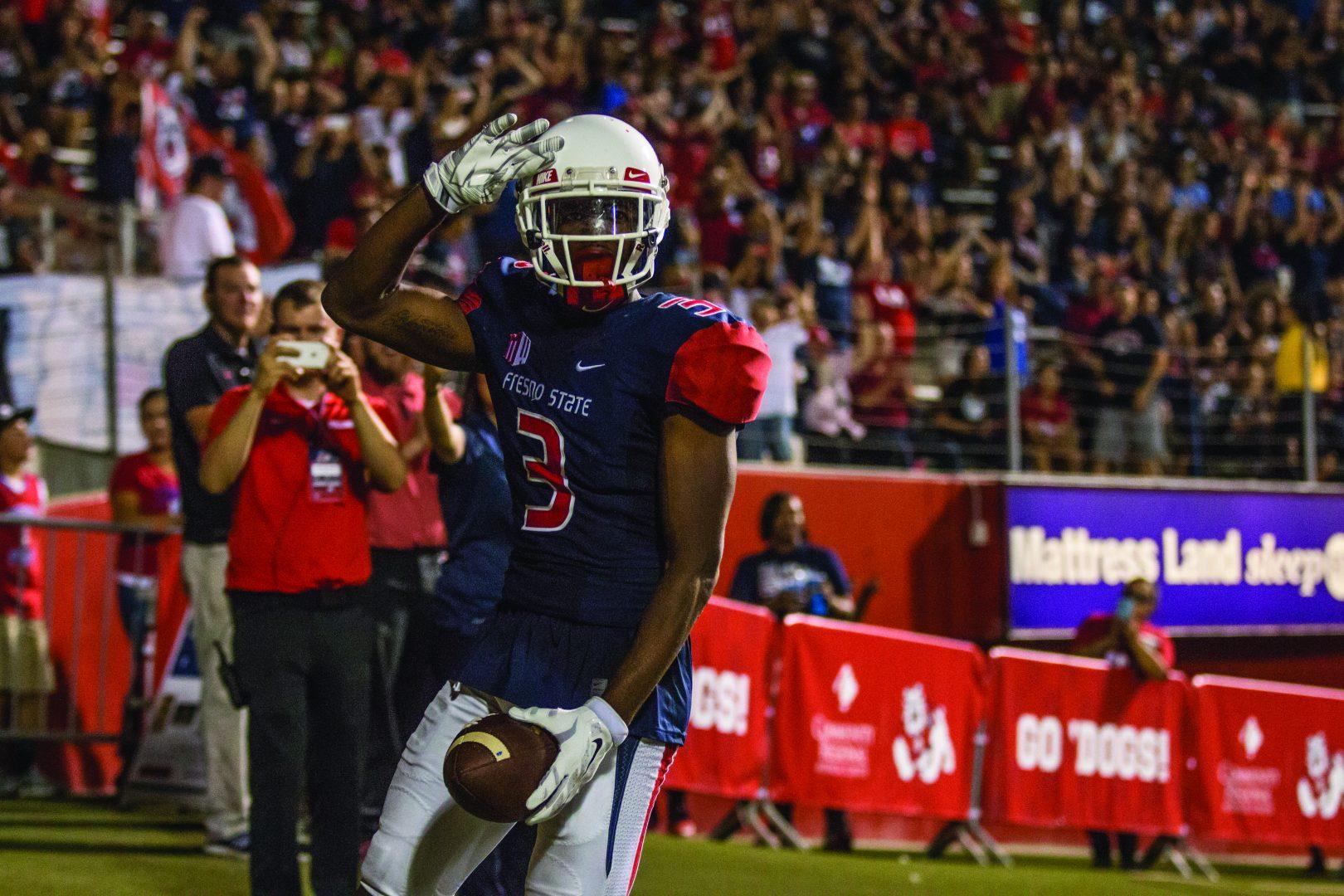 KeeSean+Johnson+%28%233%29+celebrates+after+catching+a+touchdown+pass+in+Fresno+States+victory+against+Sacramento+State+on+Saturday%2C+Sept.+10%2C+2016+at+Bulldog+Stadium.+%28Khone+Saysamongdy%2FThe+Collegian%29