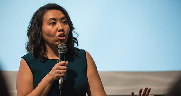 Doua Thor, executive director of White House initiatives on Asian Americans and Pacific Islanders, welcomes attendees to the discussion panel in the Alice Peters Auditorium in the Craig School of Business Sept. 16, 2016. (Khone Saysamongdy/The Collegian) 