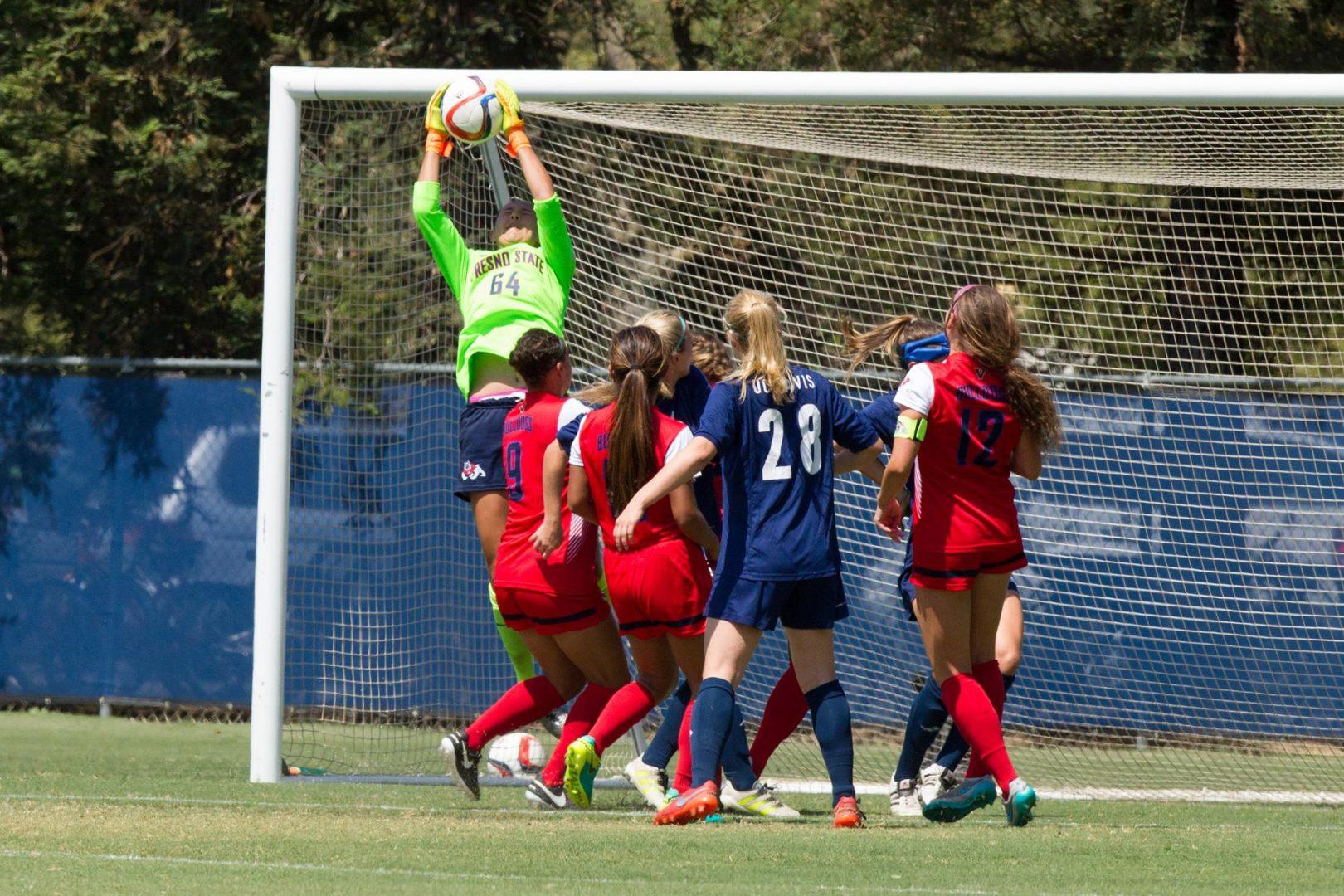 Nicole Theroux blocks a goal  against the Aggies as part of her career-high 11 saves. (Fresno State Athletics)