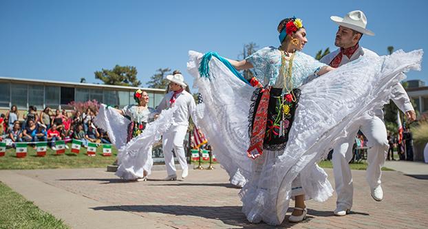 Los Danzantes de Aztlan performs in the Peace Garden during the La Bienvenida event, Sept. 16, 2016. The performers are part of the Mexican folkloric dance program of the Chicano and Latin American Studies Department. (Khone Saysamongdy/The Collegian)