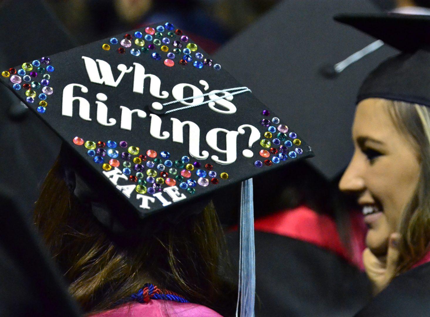 Many of the caps of the graduates carried messages, such as the one by Kara Crookston, left, during Fresno State Universitys 101st Commencement at the Save Mart Center in Fresno, California, on Saturday, May 19, 2012. (John Walker/Fresno Bee/MCT)
