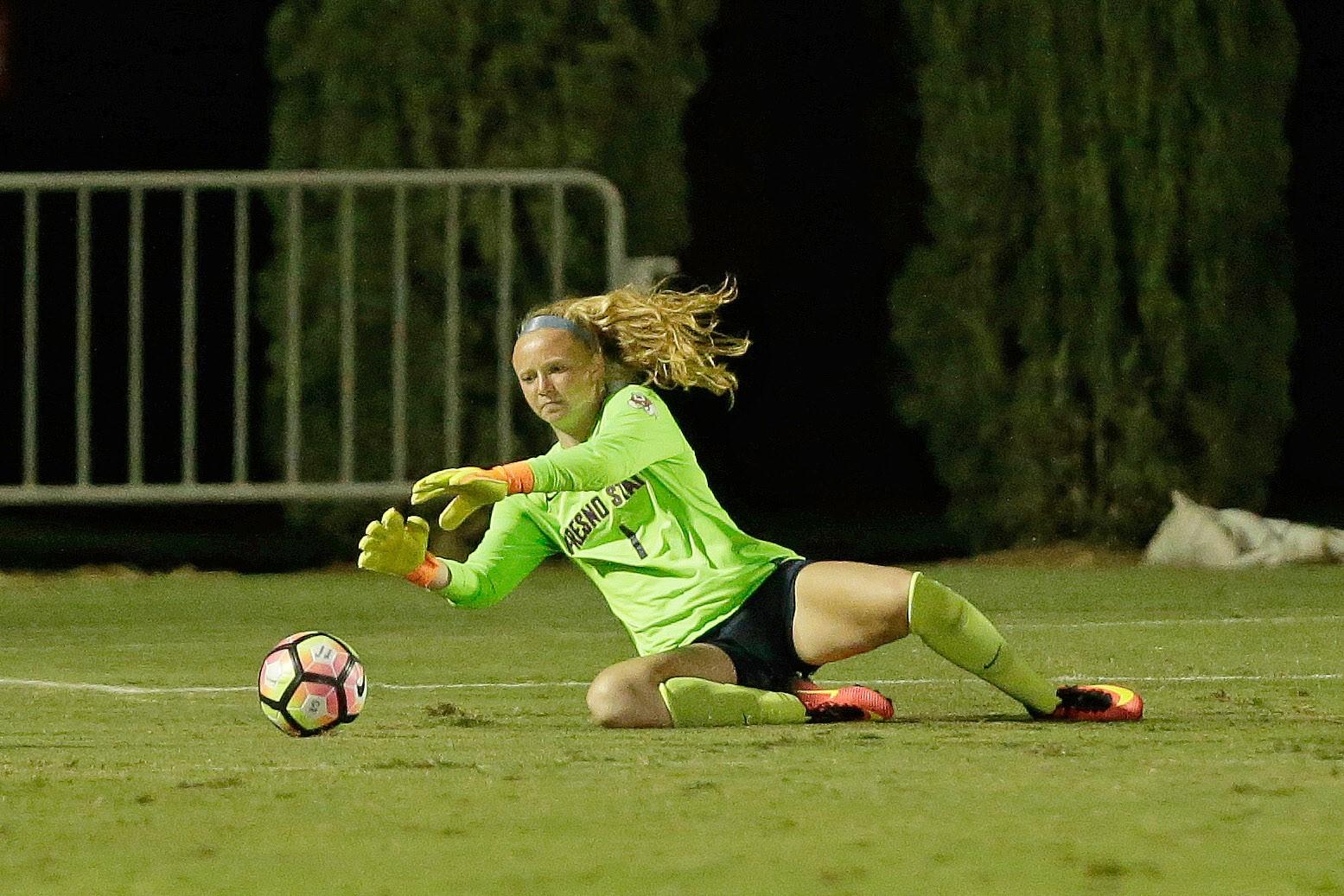 Fresno State womens soccer goalie Marie Berwinkel-Kottman saves a ball from going into the back of the net. (Courtesy of Fresno State Athletics)