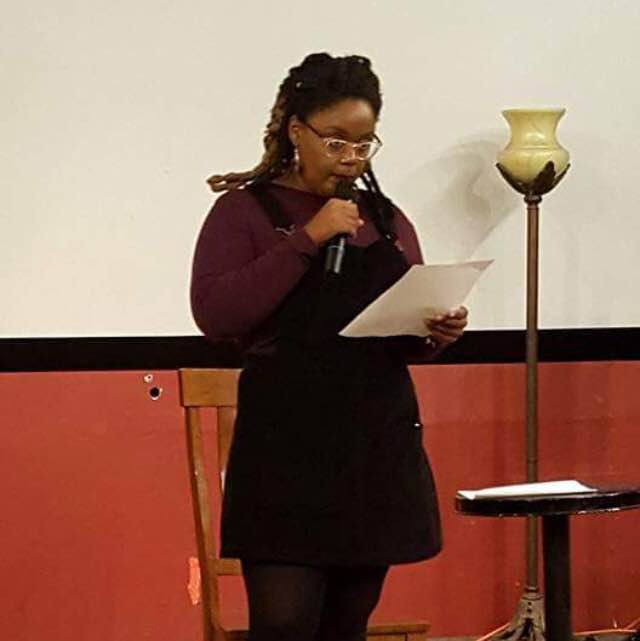 Erica Hughes reads her poems at MFA student reading. Courtesy of San Joaquin Literary Arts Facebook page. 