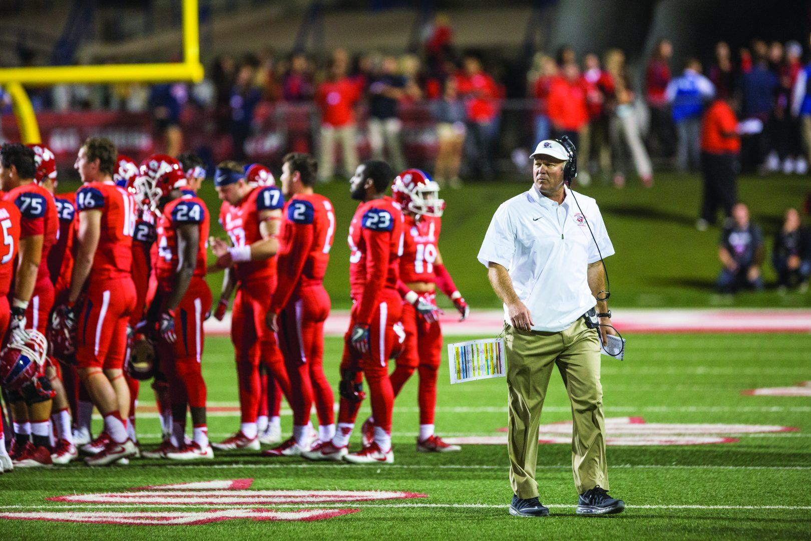 Former Fresno State head football coach Tim DeRuyter returns to the sideline after talking to the team during a game against San Diego State on Oct. 14, 2016, at Bulldog Stadium. (Khone Saysamongdy/The Collegian)