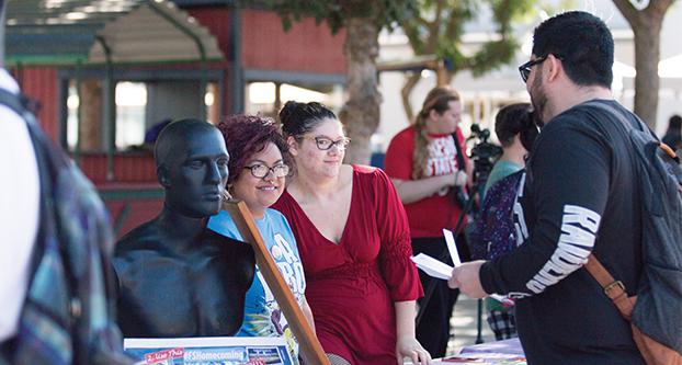 Fresno State students attend the LGBT Fair at Fresno State University on Tuesday, Oct. 11, 2016. (Yezmene Fullilove/The Collegian)
