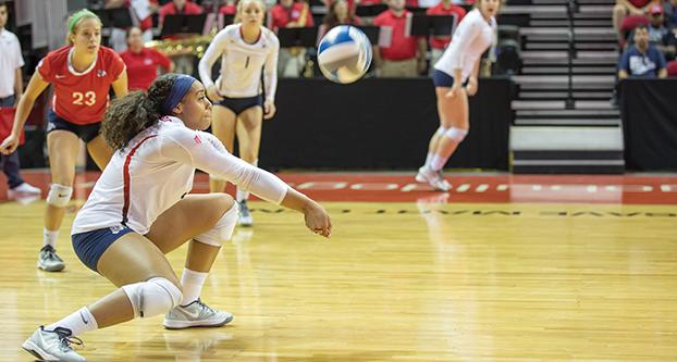 Senior outside hitter Aleisha Coates sets the ball for a teammate during a home game at the Save Mart Center against San Diego State on Saturday, Nov. 5, 2016. (Christian Ortuno/The Collegian)