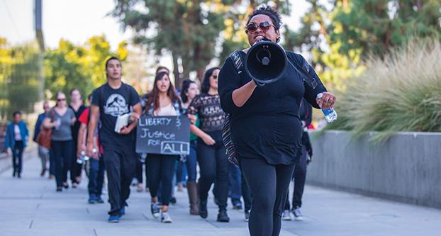 Fresno State student Nicole Turpin leads the march during the “Fresno State Rejects Hate” rally on Nov. 15, 2016 (Khone Saysamongdy/The Collegian).