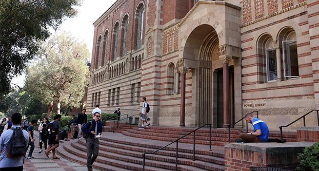 Students walk by the Powell Library at UCLA in March 2016. (Glenn Koenig/Los Angeles Times/TNS)