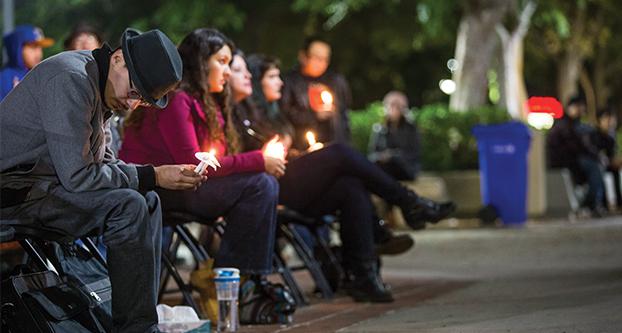 A vigil and open mic poetry is held to honor the late Mireyda “Mia” Barreza Martinez at Fresno City College on Dec. 6, 2016.  Martinez was a Fresno State teaching associate in the Department of English and a graduate assistant (Khone Saysamongdy/The Collegian).  