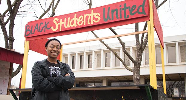 Diamond Morehead stands in front of the Black Students United club booth on Monday, Feb. 6, 2017. (Yemen Fullilove/ The Collegian)
