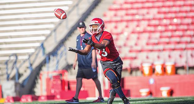 Sophomore running back Bryson Oglesby runs to catch the ball at Fresno State football’s first spring practice on March 27, 2017, at Bulldog Stadium. (Khone Saysamongdy/ The Collegian)